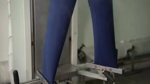 View of pants steaming in special machine Stock Footage 152963633