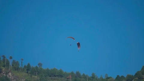 View of the parachute above the green mountain peak at Solang Valley in Manali,  Stock Footage 201477788