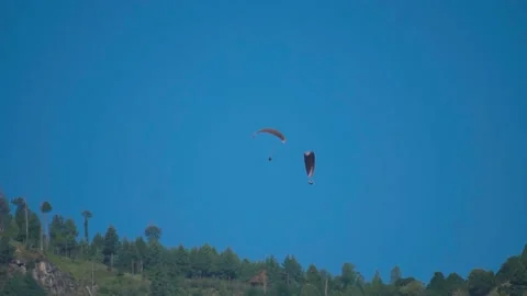 View of the parachute above the green mountain peak at Solang Valley in Manali,  Stock Footage 201477817