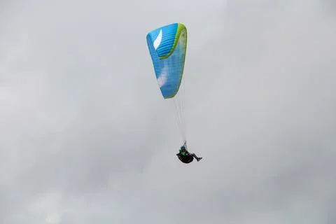 View of a paraglider in grey clouds Foto stock