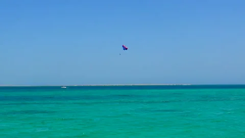 A view to the paragliders during session over Red Sea in Hurghada. Stock Footage 155406637