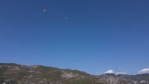 View of paragliding gliding on high mountain Stock Footage 165842844