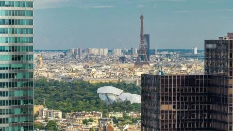 View of Paris and Eiffel Tower timelapse from the top of the skyscrapers in P Stock Photos