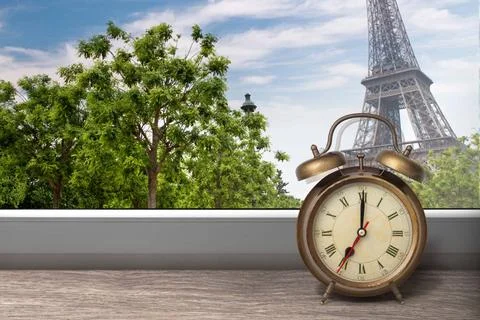 View of Paris and Eiffel tower from window with alarm clock View of Paris ... Stock Photos