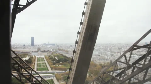 View of Paris during a Cloudy Day from Inside of An Eiffel Tower Elevator. 4K. 스톡 동영상 252766040
