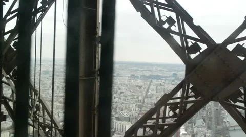 View of Paris from moving Eiffel Tower Lift Stock Footage 62902171