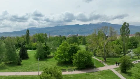 View from the park. Clouds over mountain. Rise-up. Stock Footage 197074461