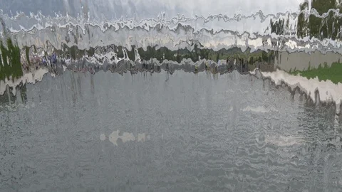 View of a park through a waterfall1 4K Stock Footage 95432114