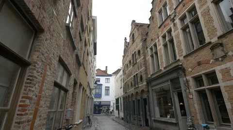 View of parked bikes near shops on Wapenmakersstraat, Bruges Stock Footage 59658352