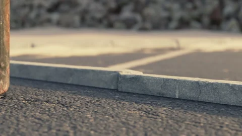 View of a parking lot surface showing pavement and concrete details Stock Footage 344866598