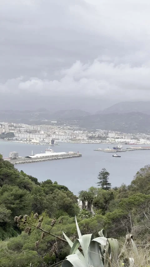 View from Parque de San Amaro over Ceuta City and Port on a cloudy day Stock Footage 311645304