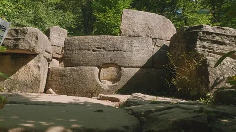 View of part of ancient building dolmen among trees Stock-Footage 81145529
