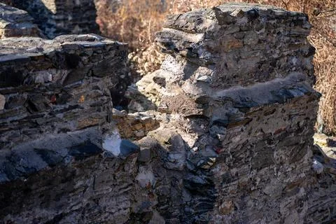 View of part of the destroyed brick wall of an ancient European castle Stock Photos