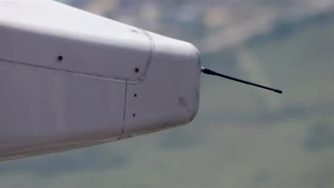 View on part of flying airplane over land - static wicks - static discharges Stock-Footage 345040629
