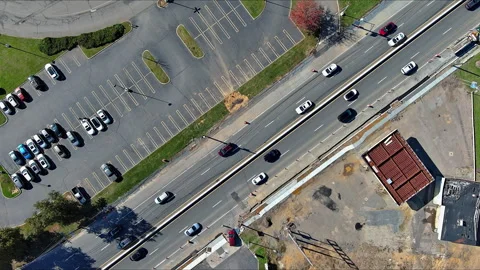 View of partially filled parking lot next to busy roadway in East Brunswick New Stock-Footage 337741169