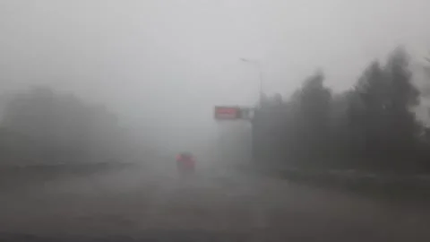 View from a passenger car during a rainstorm Stock Footage 311476844