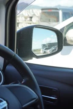 View from the passenger compartment to the side mirror. 스톡 사진