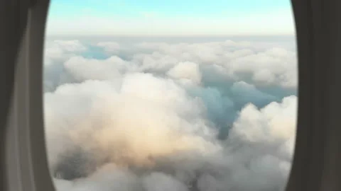 View from passenger plane window of a scene with thick white clouds over the Stock Footage 158210290