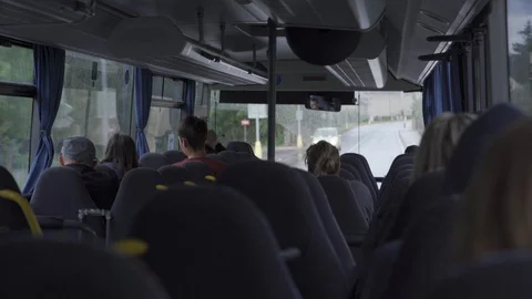 View of a passenger sitting in the back seat of an urban transport bus Stock Footage 115766356