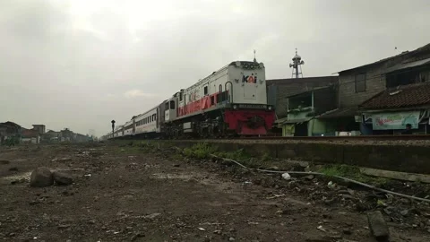 View of Passenger Train Passing by a Rail in Bandung Indonesia Stock Footage 220610120