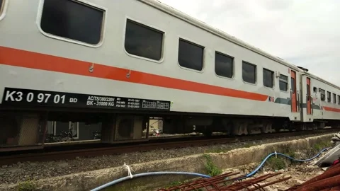 View of Passenger Train Passing by a Rail in Bandung Indonesia. Stock Footage 220612644