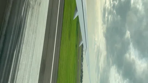 View from passenger window, airplane ready to take off at airport Stock Footage 251242659