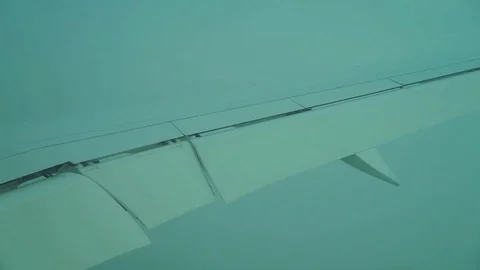 View from the passenger window on the wing of an airplane in a cloud. Video stock 125281483