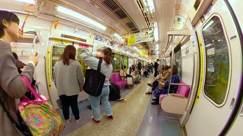 The view of the passengers going in and out of the train in Osaka Japan Stock Footage 129279073
