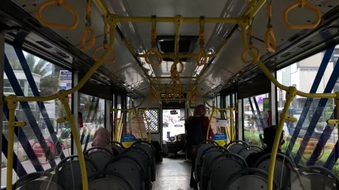 View of passengers inside a moving bus of Trans Jakarta Stock Footage 300550931