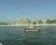 View of passing boat and Dolmabahce Palace across river SD Footage