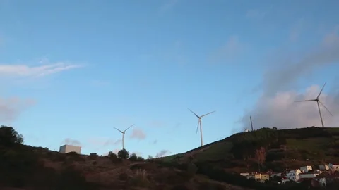 View from a passing car on large wind turbines Stockbeeldmateriaal 109503224