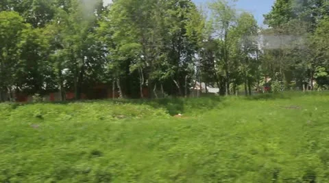 View of passing landscape from a train window. Stock-Footage 11140010