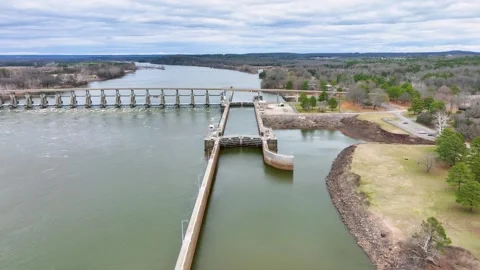 View passing over a lock, dam, and bridge on the Arkansas river. Video stock 266918734