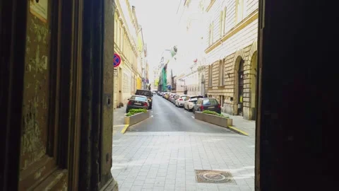 View Passing through the Gate of an old Budapest Building Revealing the Street Stock Footage 139117787