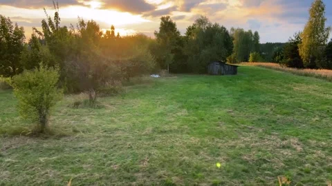 A view from a passing train window of a village and a building materials factory Video stock 318977690