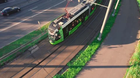 View of a passing tram from above. Green public electric transport. Stock Footage 201519129