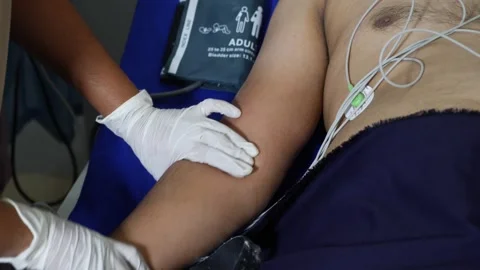 View of Patient bending hand after blood sample collection, health check up v Vídeo Stock 147697809