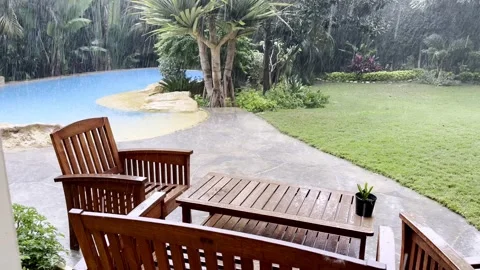 View of Patio and pool on a heavy rainy day, Cairo, Egypt Vidéo 232873868