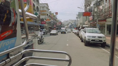 View of Pattaya streets from window of moving sangteo Stock Footage 88403382