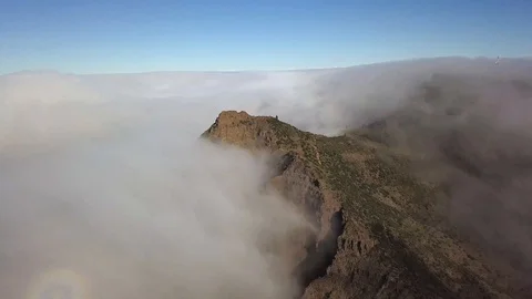 View of the peak of the mountain sticking out among the clouds Tenerife Stock Footage 106879717