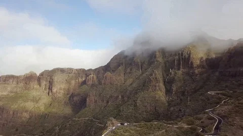 View of the peak of the mountain sticking out among the clouds Stock-Footage 106879728