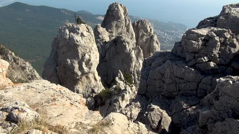 View of peaked trident-shaped rocks on top of the mountain Ai Petri. Stock Footage 106799998