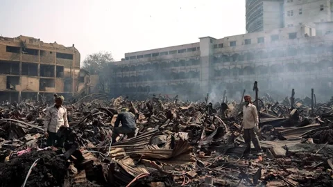View of people among fire debris in Dhaka, Bangladesh. Stock Footage 335562645