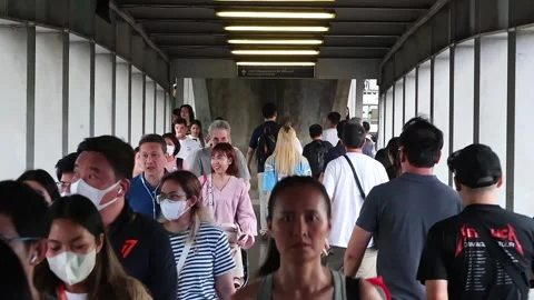 View of people at BTS Asok skytrain station skywalk. Stock Footage 280362700