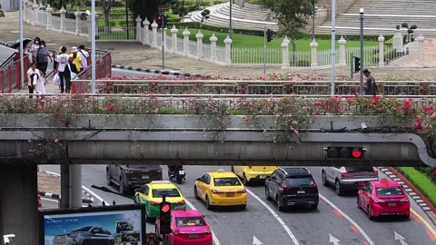 View of people at BTS Victory Monument skytrain station skywalk. Stock Footage 282908116