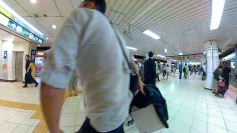 View of the people busy walking inside the subway station in Osaka Japan Stock Footage 129278762
