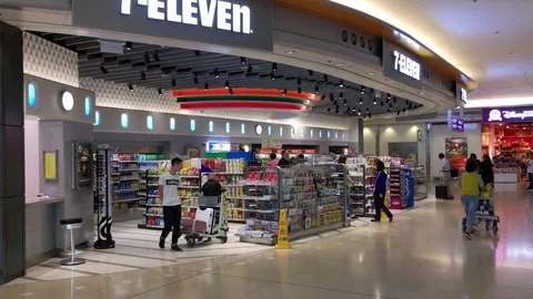 View of people buy goods at the Hong Kong Seven Eleven store Stock Footage