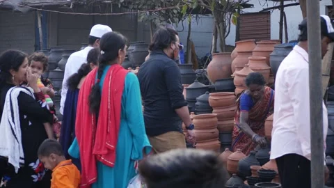 View of People buying mud items from a shop Stock-Footage 147706807