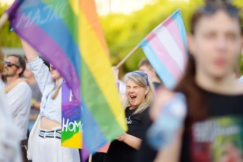 View of people column with rainbow flag and banners during Lgbt Pride Parade Stock Photos