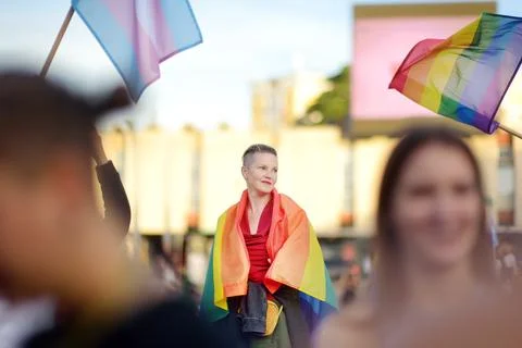 View of people column with rainbow flag and banners during Lgbt Pride Parade Stock Photos